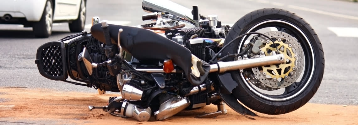 Crashed Motorcycle on road after accident