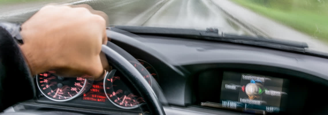 Man driving with high speed in road