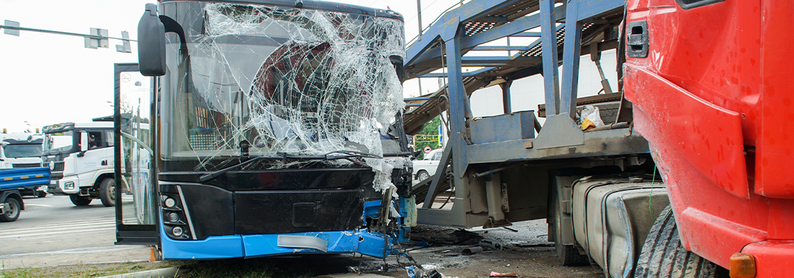 Collision between a bus and a car transporter. Truck and bus accident