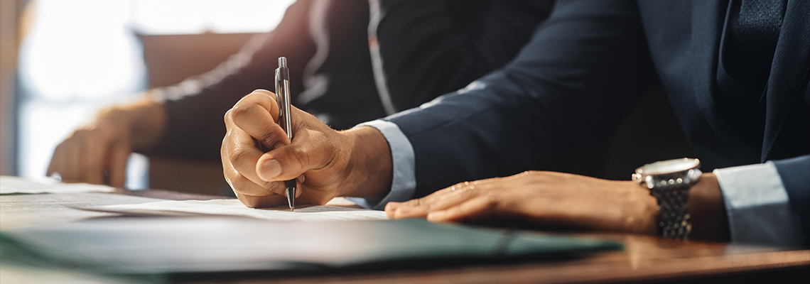 lawyer writing on document