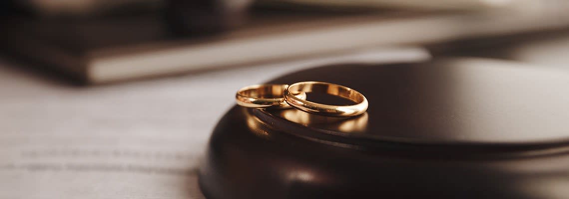 Rings resting on a gavel stand