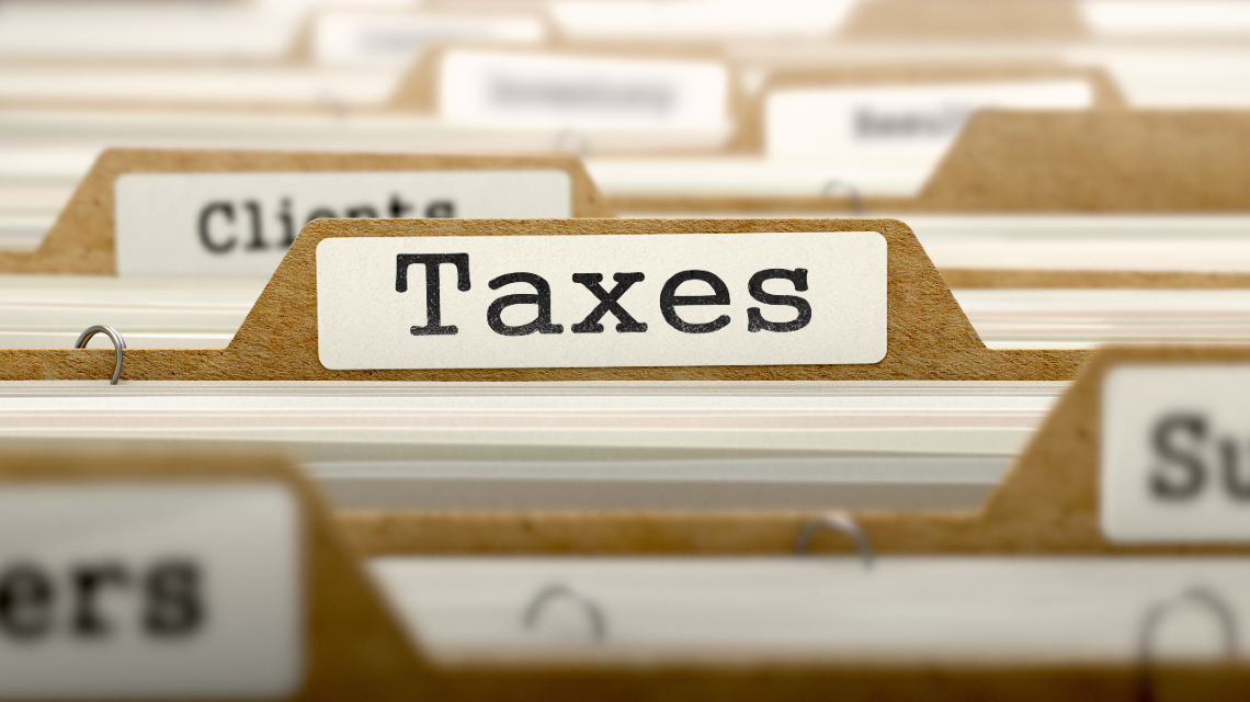 Manilla folders that say "Taxes"