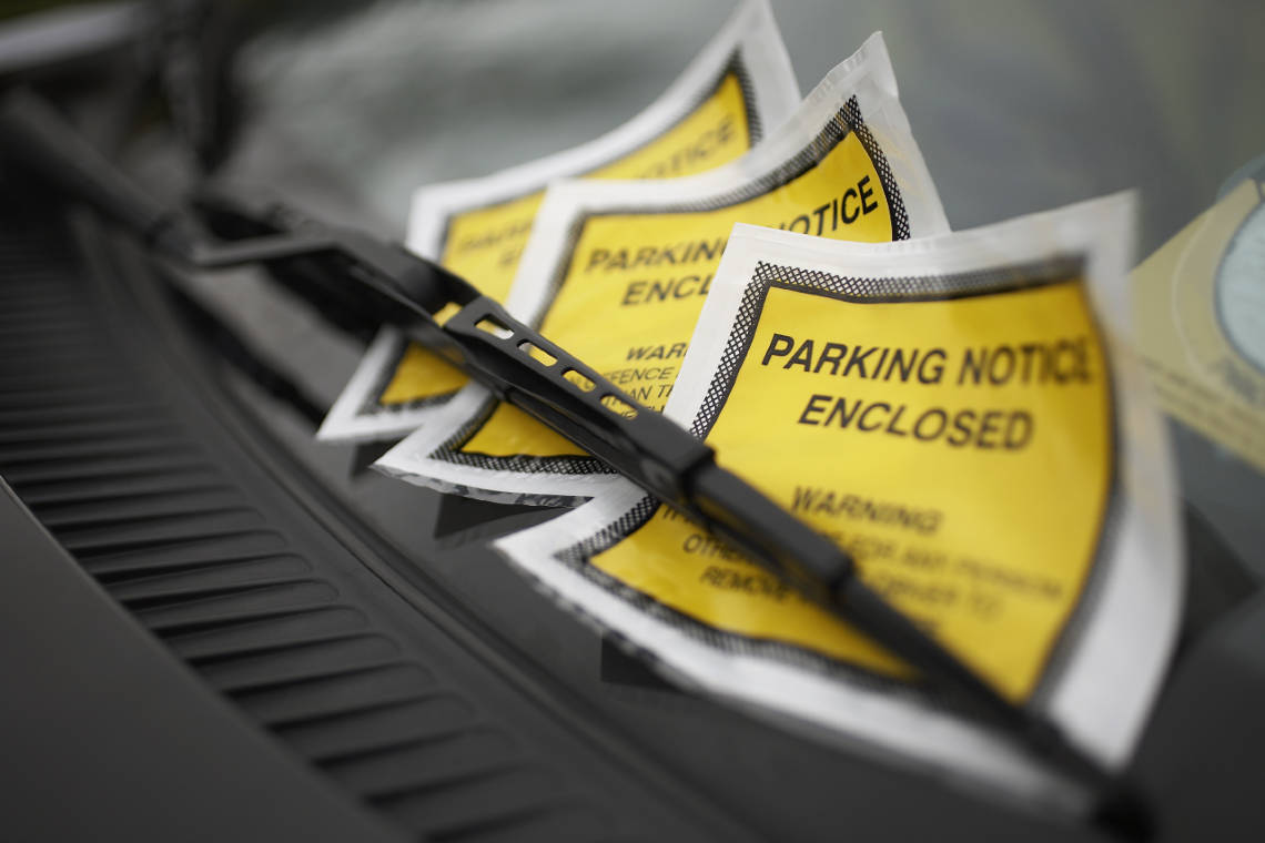 Three Parking tickets on a windshield