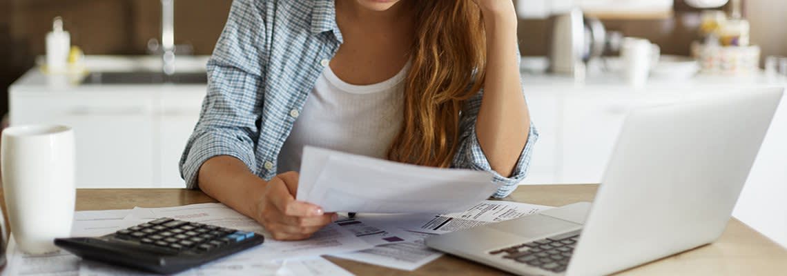 A woman does her taxes