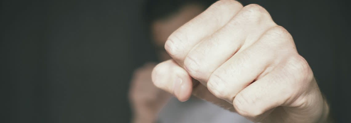 close up of man punching at the camera