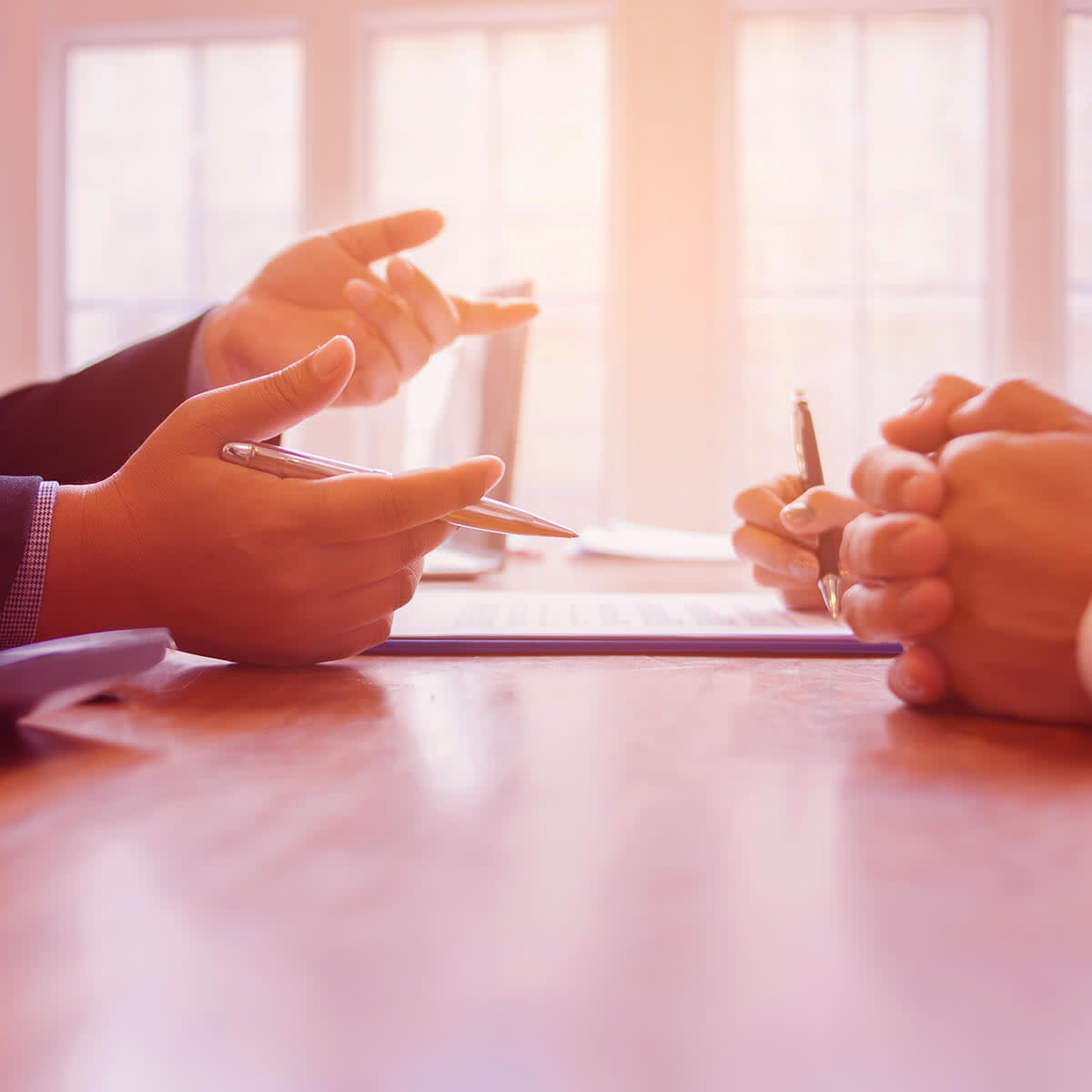 Lawyer mediating with clients