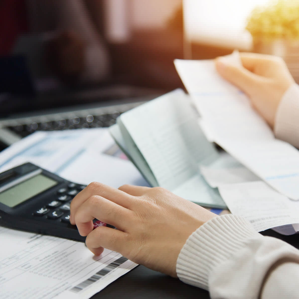 Woman calculating her Debt.