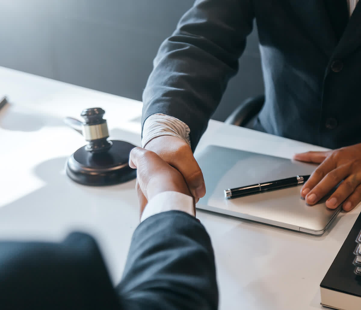 Attorney shaking hands with a client