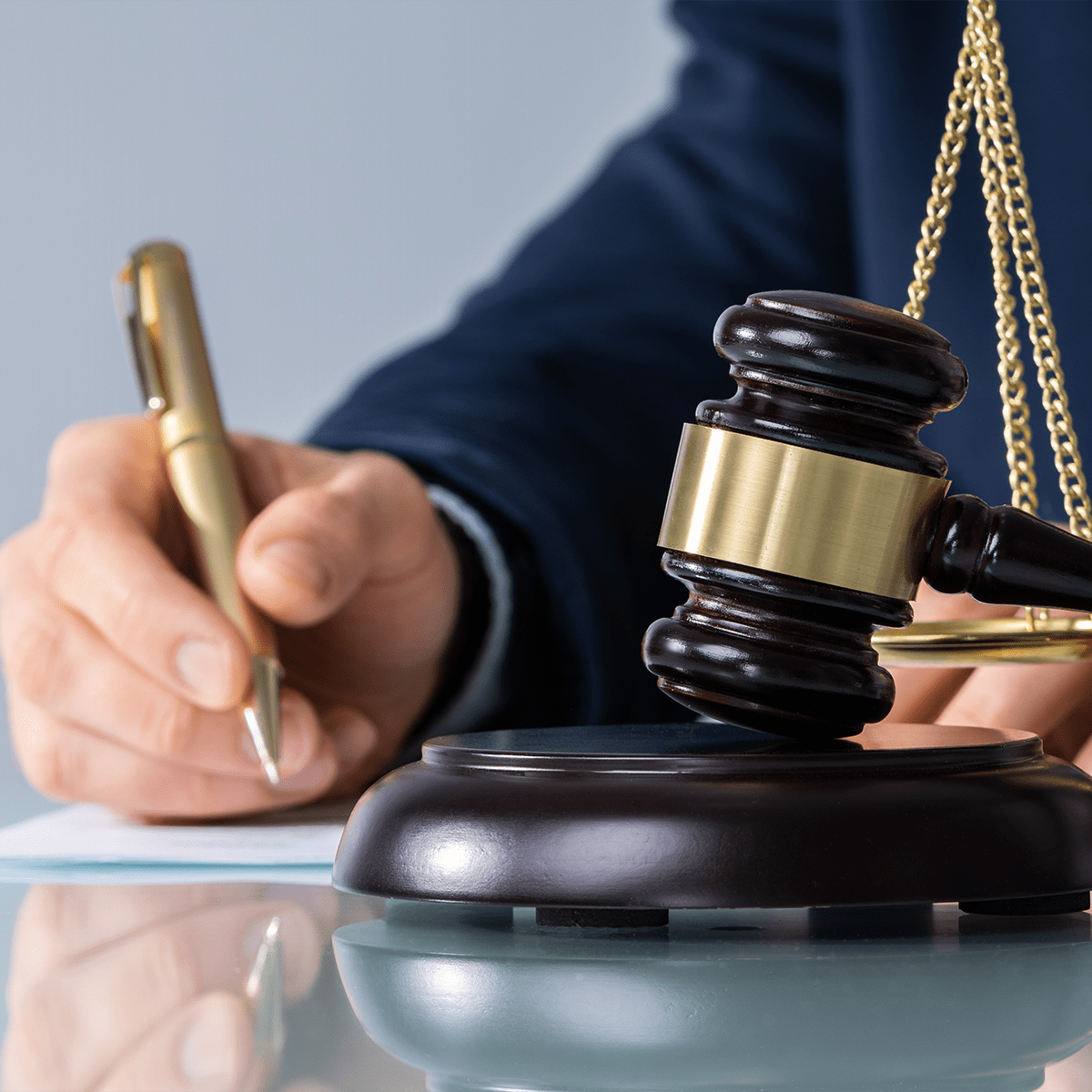 Male Judge Signing Document
