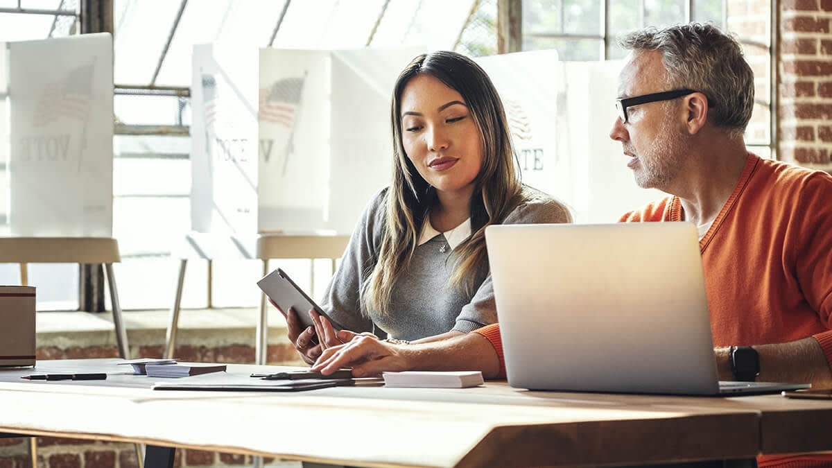 Man and woman looking at documents