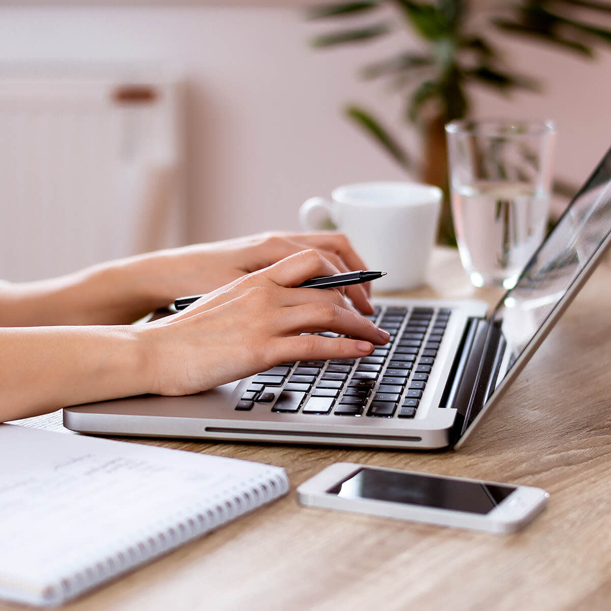 Woman typing at a computer