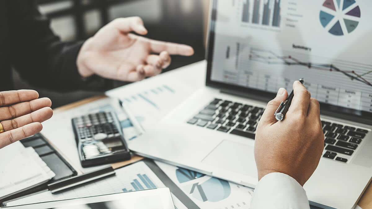 Two business people going over numbers