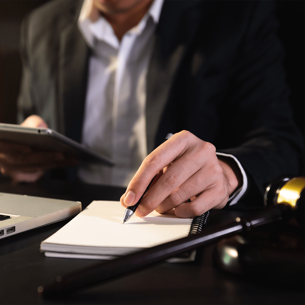 business people and lawyers discussing contract papers sitting at the table.