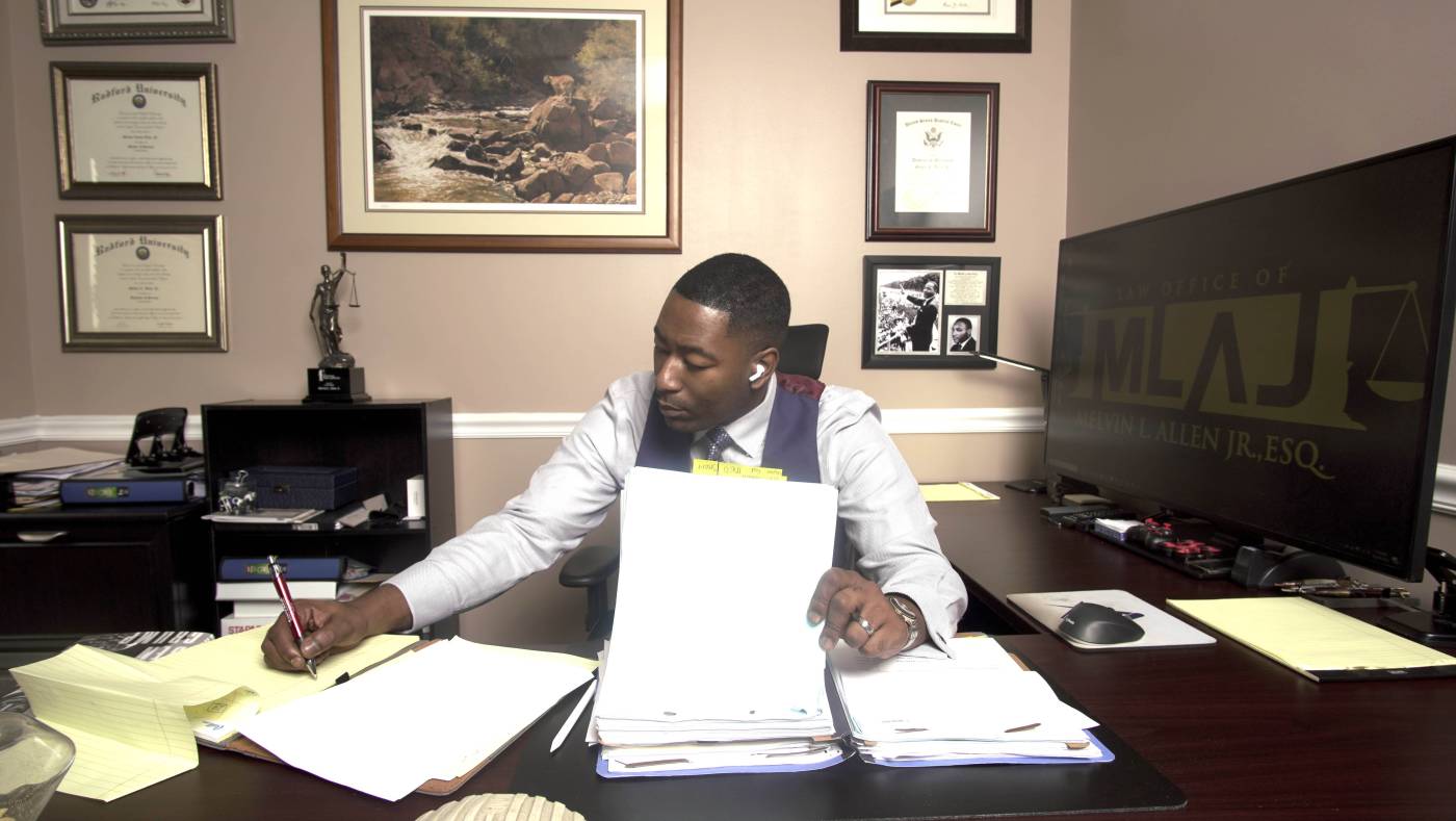Melvin Allen Jr. working at his desk