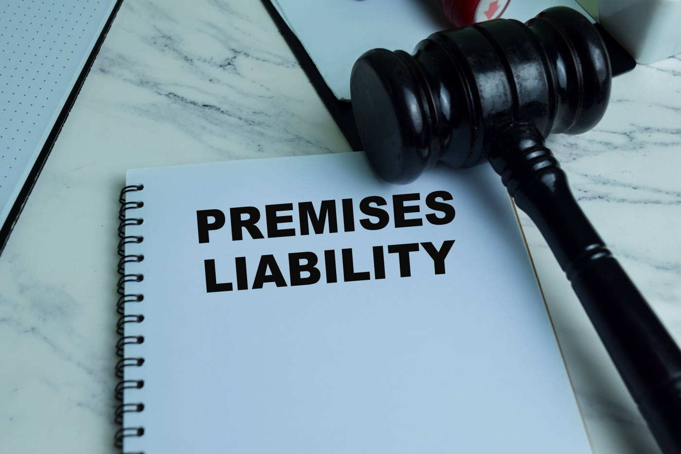 Premises Liability law book and gavel on table