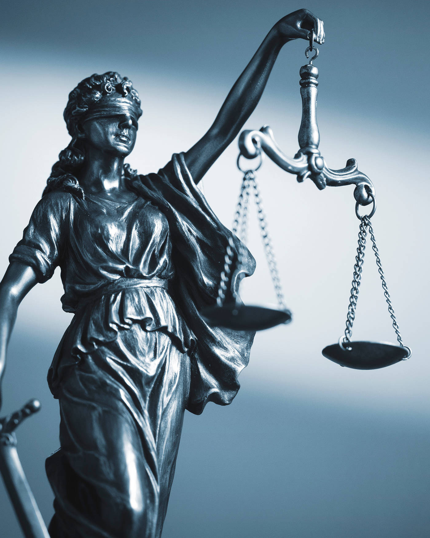 Lady of justice holding a scale.