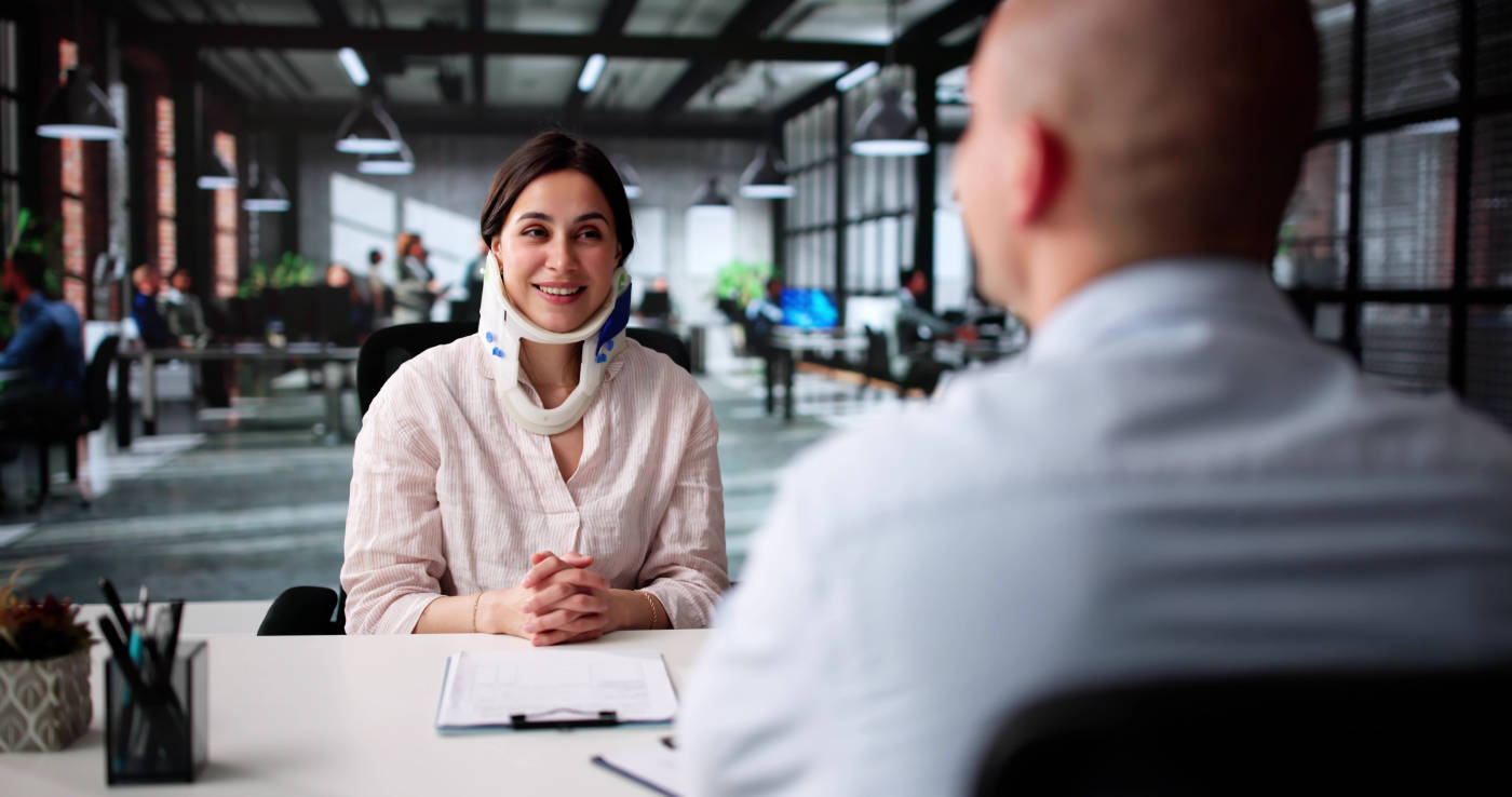 Injured women consulting with personal injury attorney