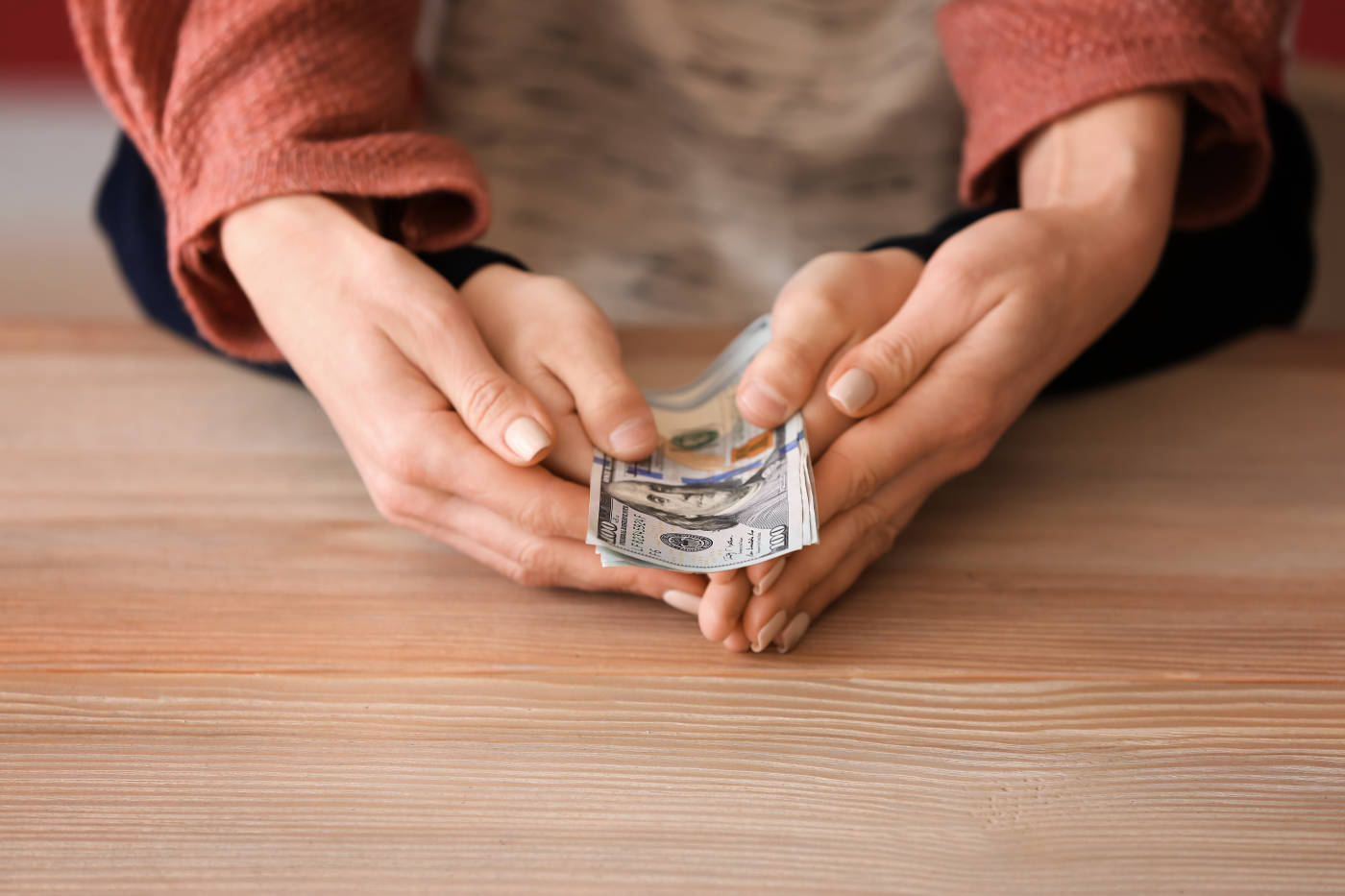 Mother and her child holding child support money in hand