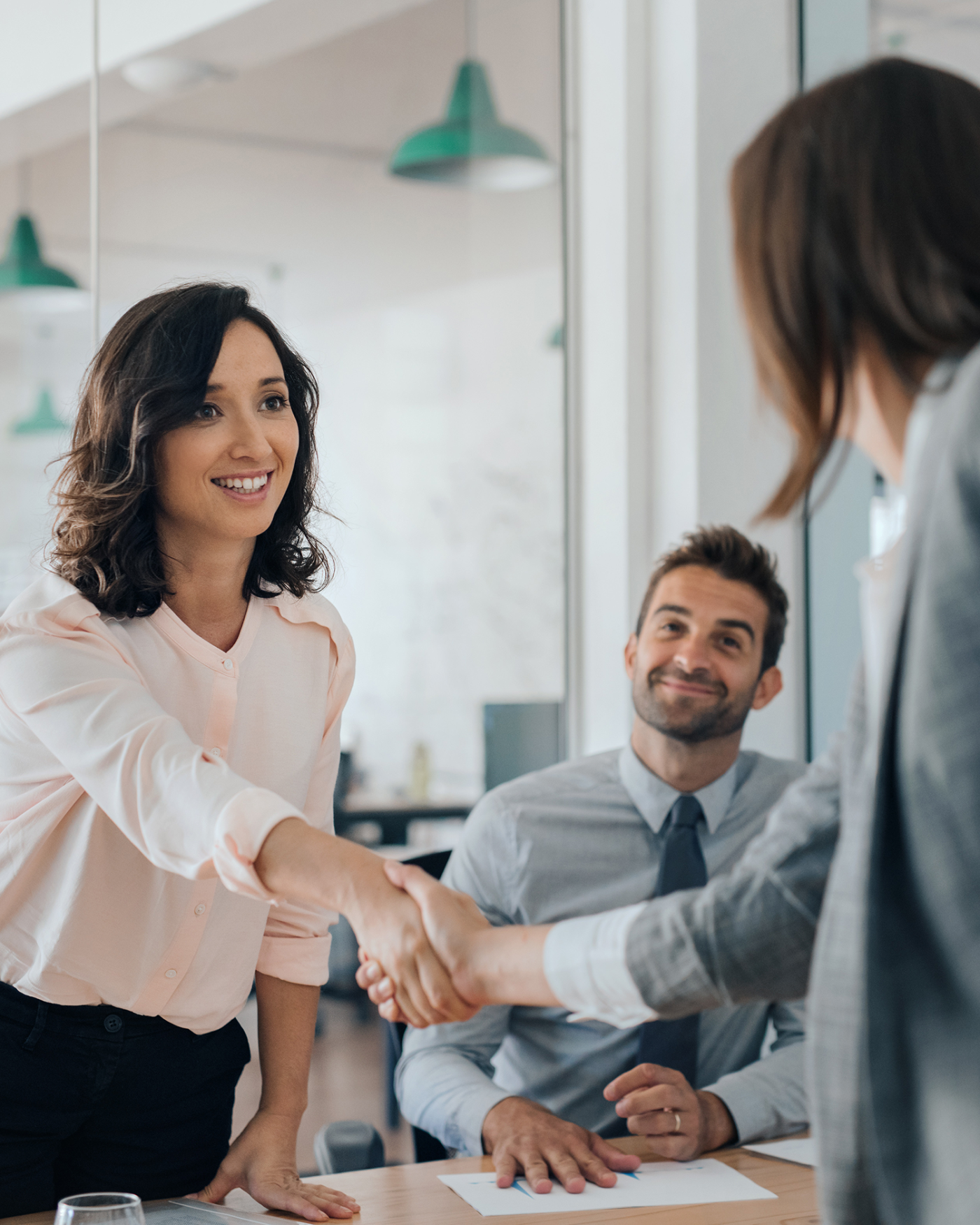 Client shaking hand with attorney