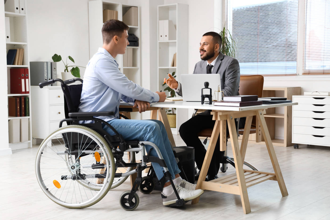Attorney working with client in wheelchair