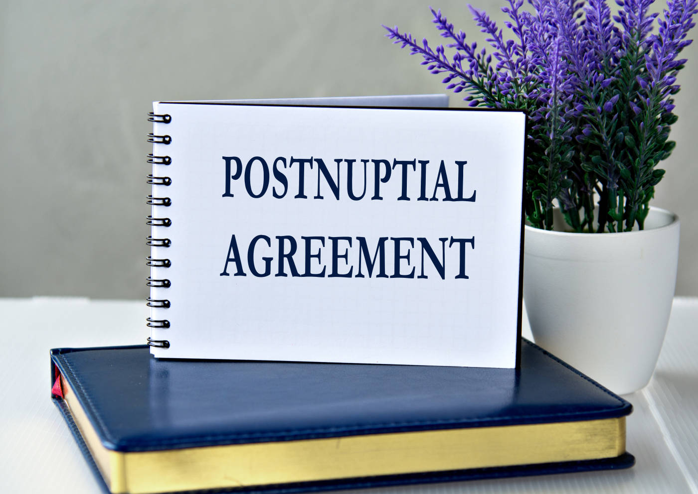 POSTNUPTIAL AGREEMENT words in a notebook
