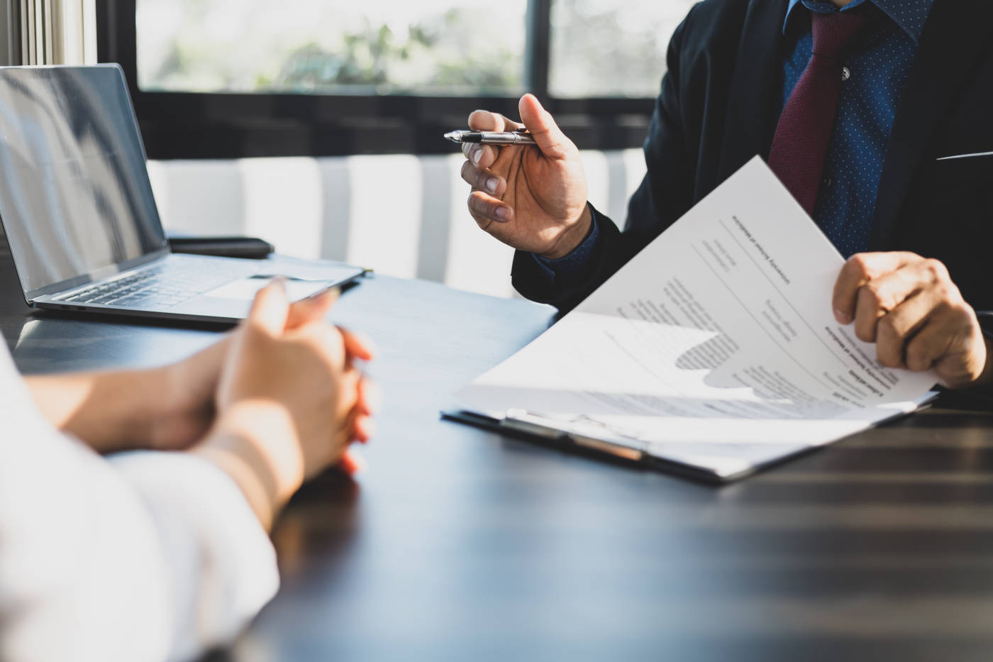 Client consulting with attorney regarding contract terms
