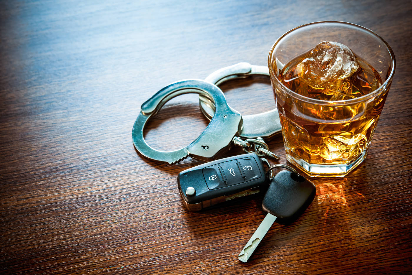 Glass of Alcohol, Car Keys and Handcuffs