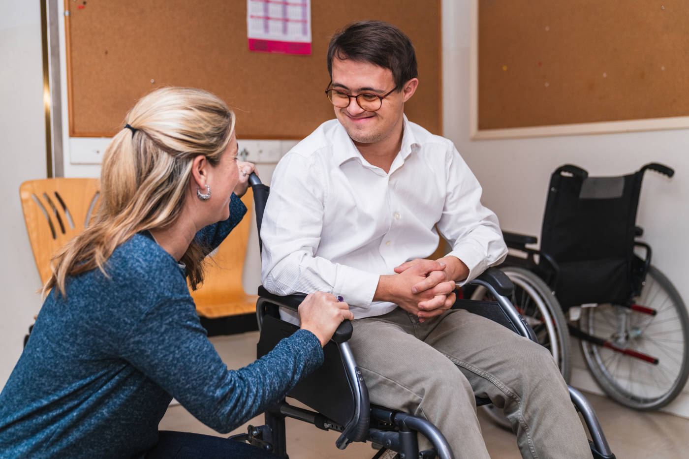 Women and a man with down syndrome in wheelchair