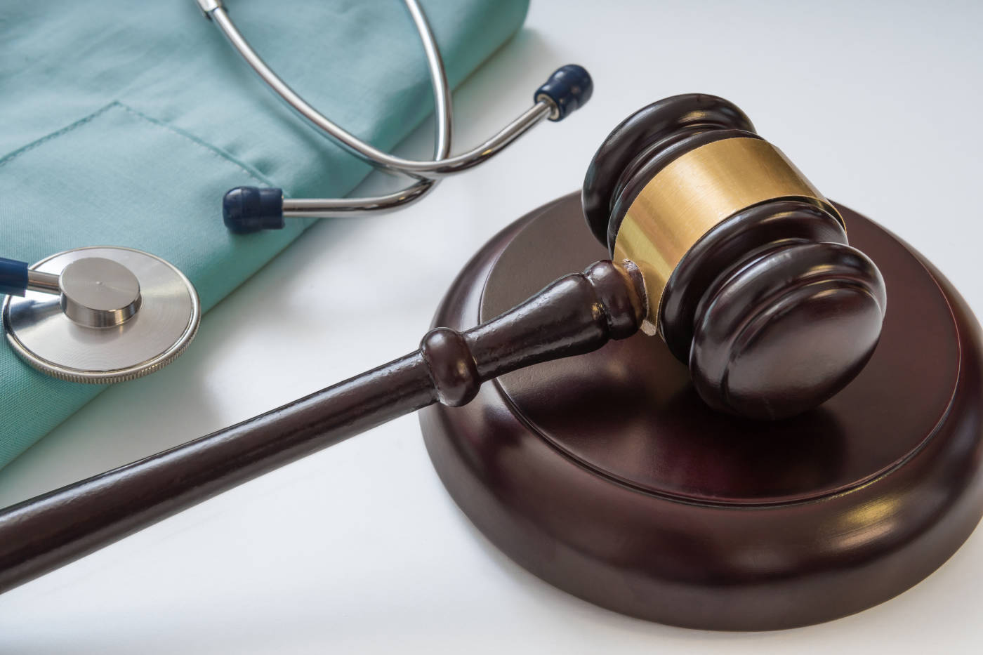 Gavel and Stethoscope in table