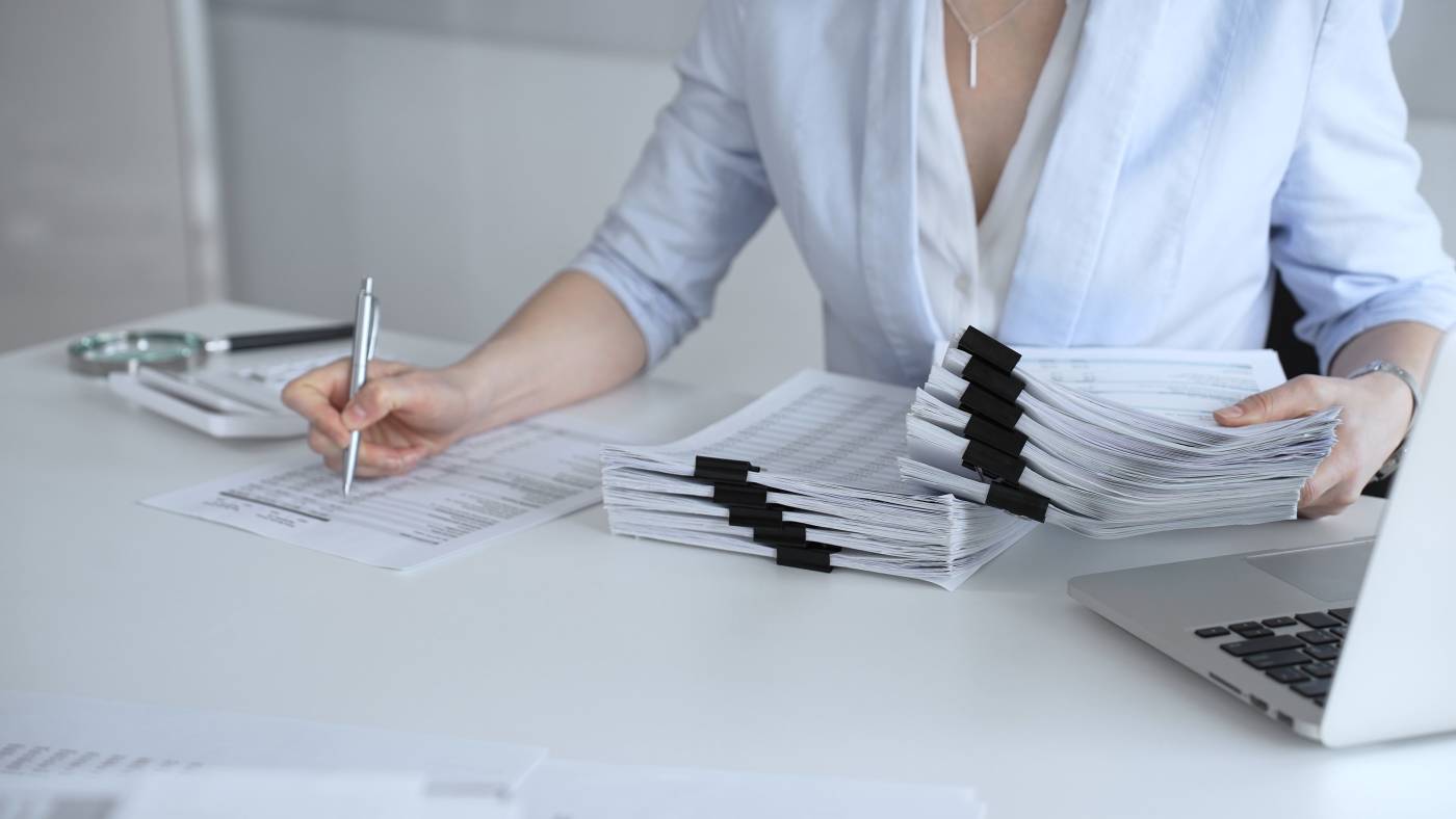 Women preparing documents for audit