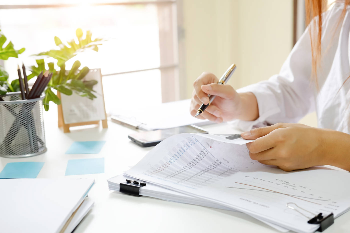 Women review financial document