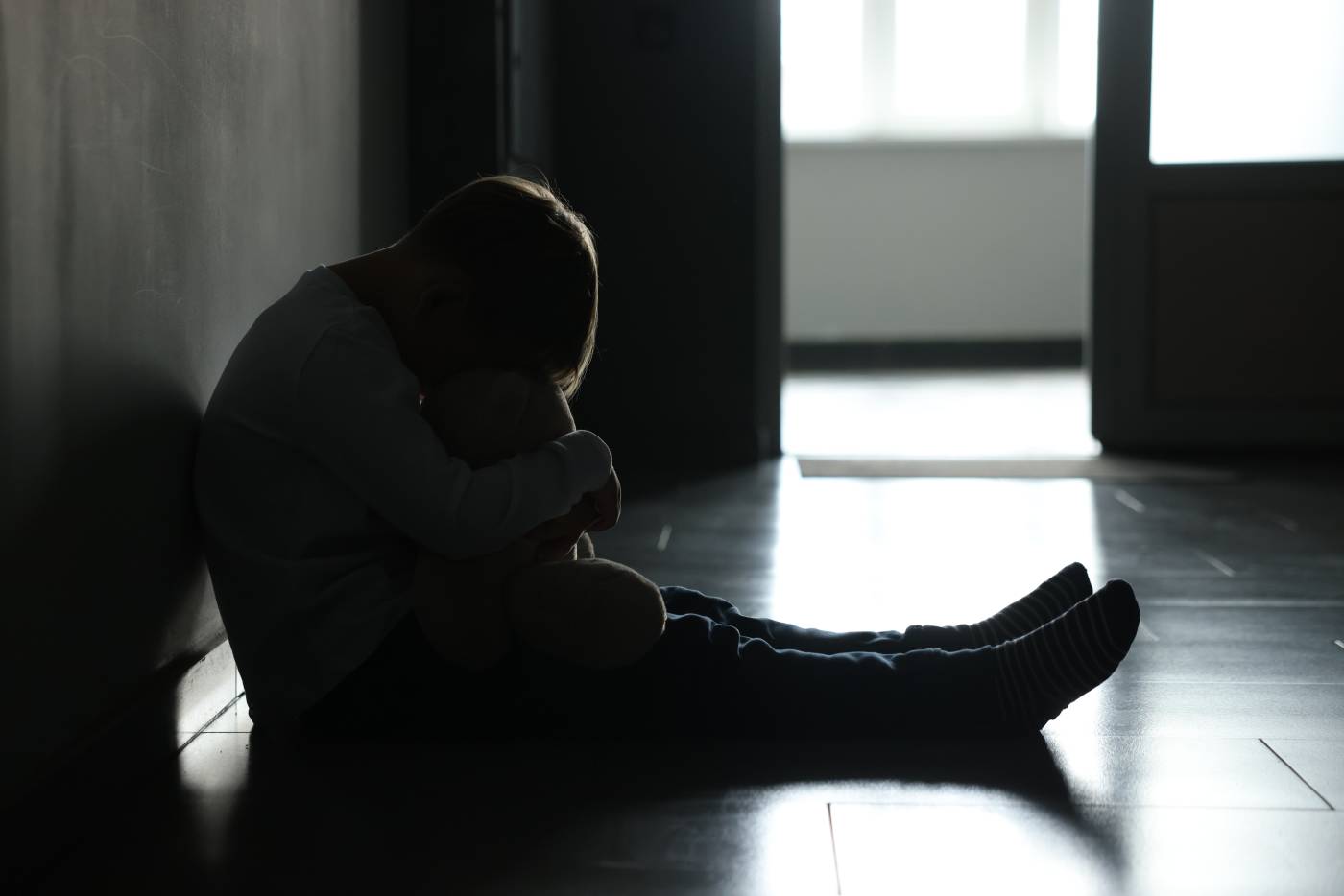Sad boy in dark room