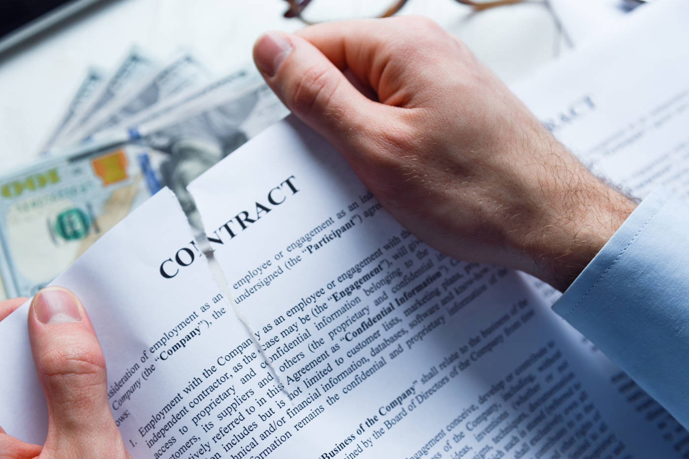 Man tearing business contract