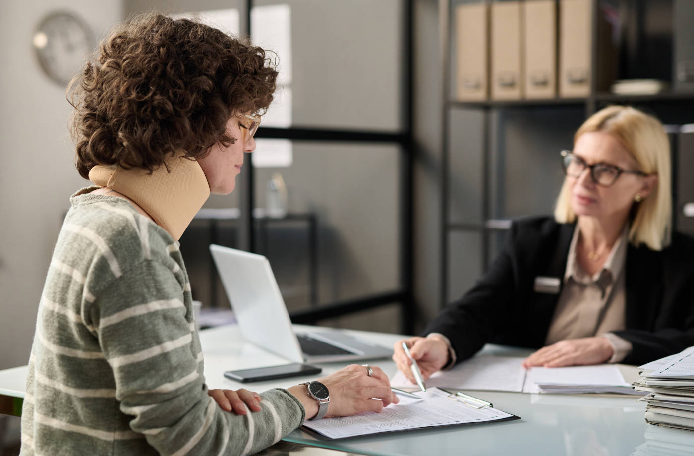 Injured women consulting with attorney
