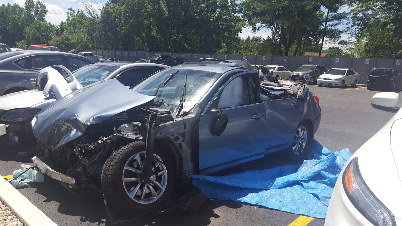 Damaged vehicle in parking lot