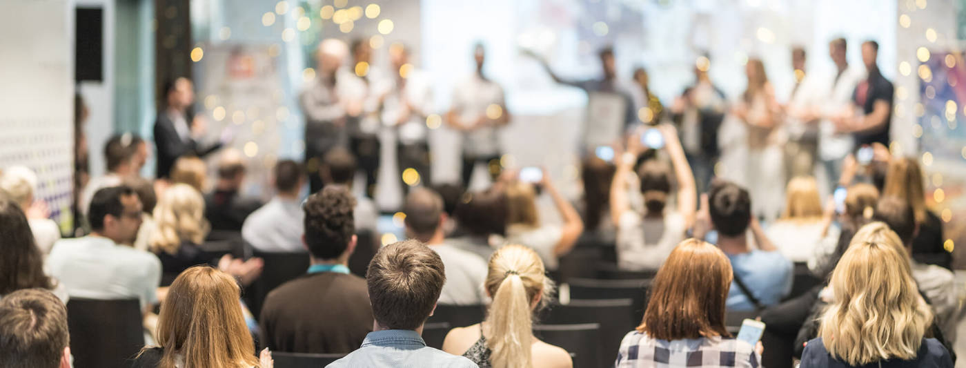 People celebrating at a conference