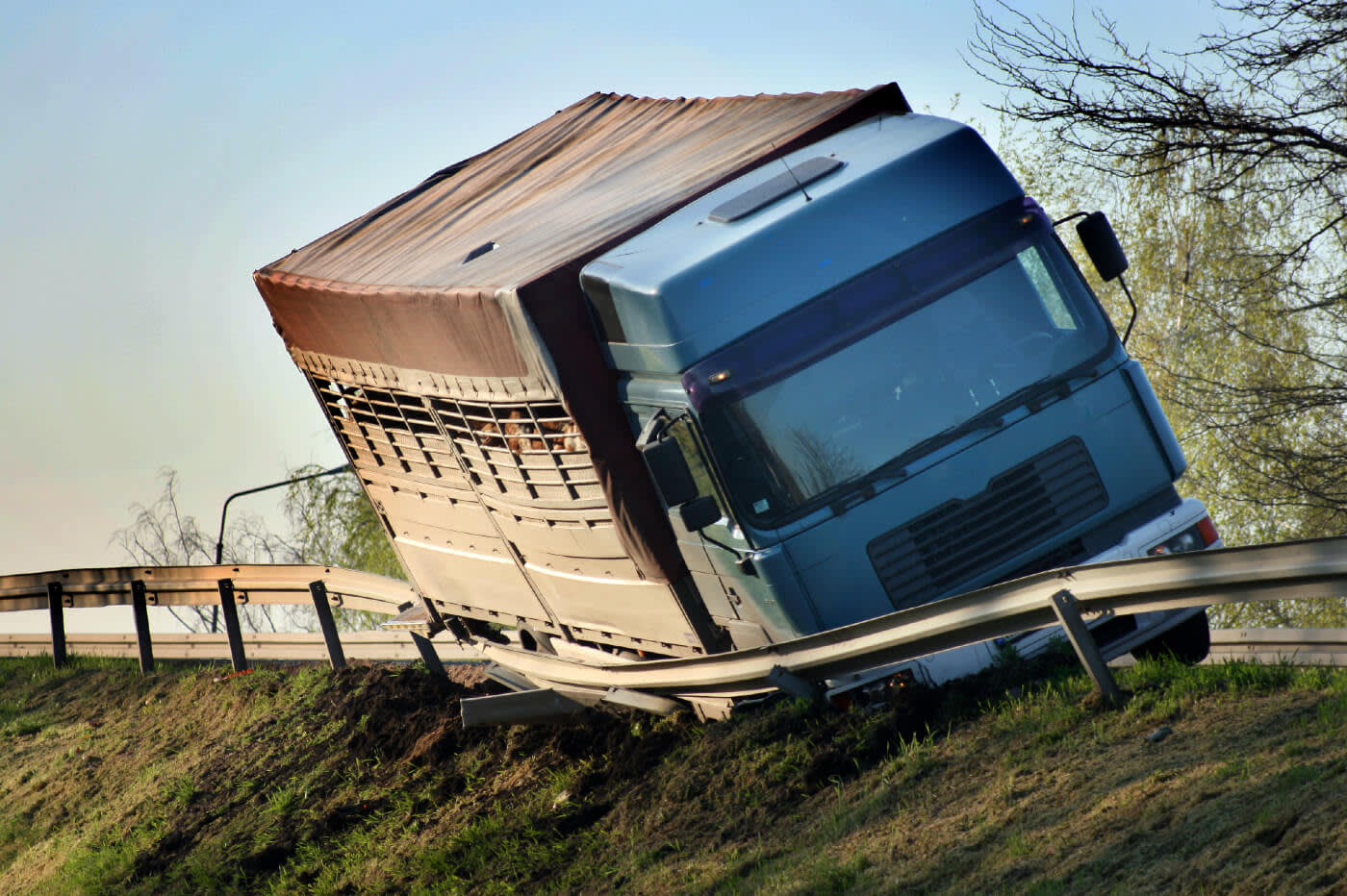 Semi-truck wrecked against railing