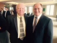 Congressman Capuano and Mike Foley wearing suits and smiling for photo