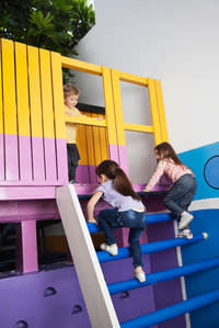 Three children playing on on a playground