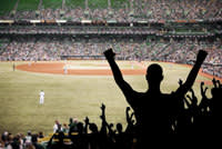 Fans celebrating in a baseball stadium