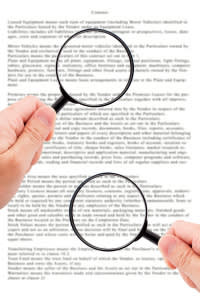 Hands holding magnifying glasses and observing document