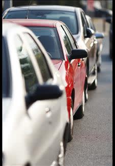 Three cars in traffic