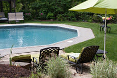 Pool chairs on a home poolside