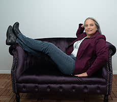 Carolyn N. Budnik on a couch