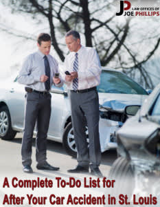 Two men in suits with phones out standing in front of cars