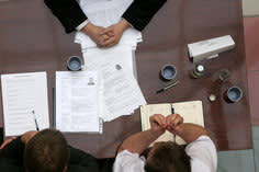 Aerial shot of a business meeting between three people