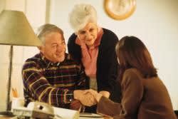 Elderly couple meeting with an attorney