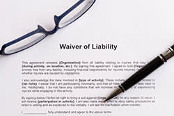 Waiver of Liability with glasses and a pen on it