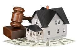 House next to gavel and money