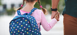Dad walking child to work